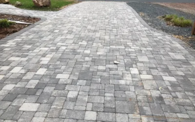 What is the Correct Base Preparation Process for a Paver Driveway Installation to Withstand Heavy Vehicle Traffic?